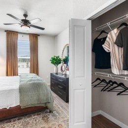 bedroom with ceiling fan and closet