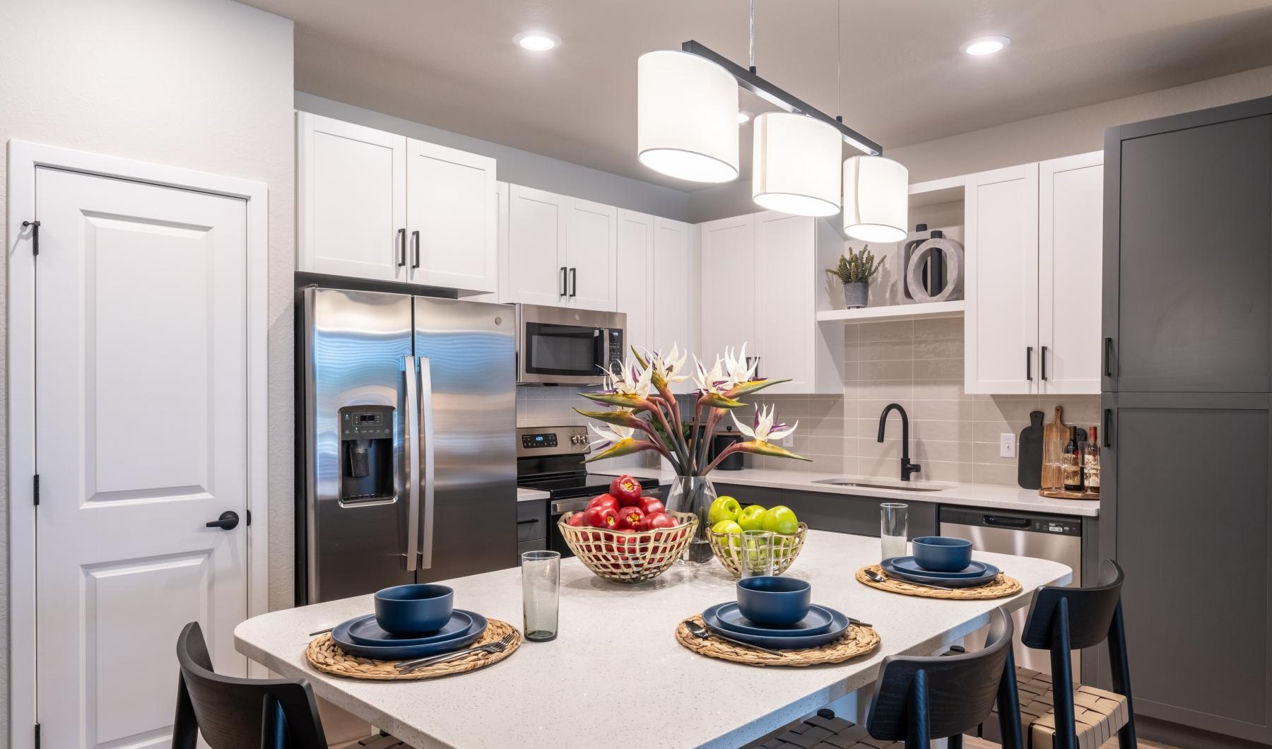 a kitchen with white cabinets