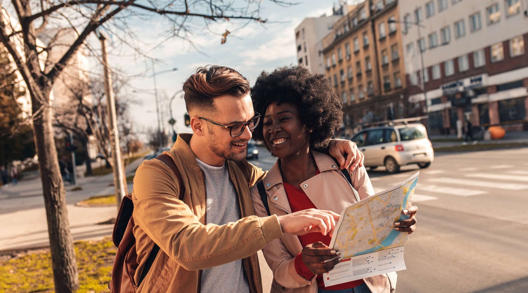 people looking at a map smiling