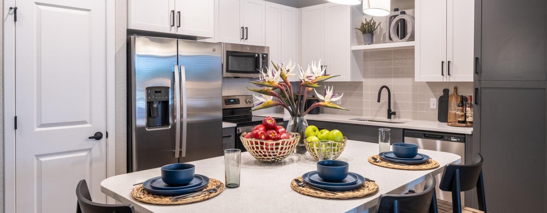 a kitchen with white cabinets